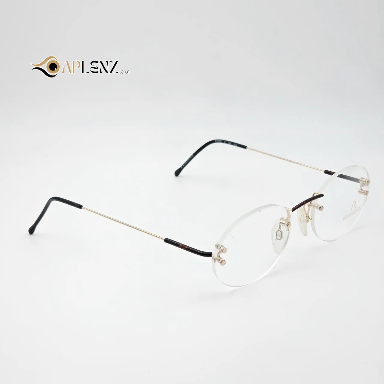 عکس نمای 45 درجه عینک طبی مردانه-زنانه گرد بدون دور برند RODENSTOCK کد ۱۷۴۹ رنگ gold,leopard