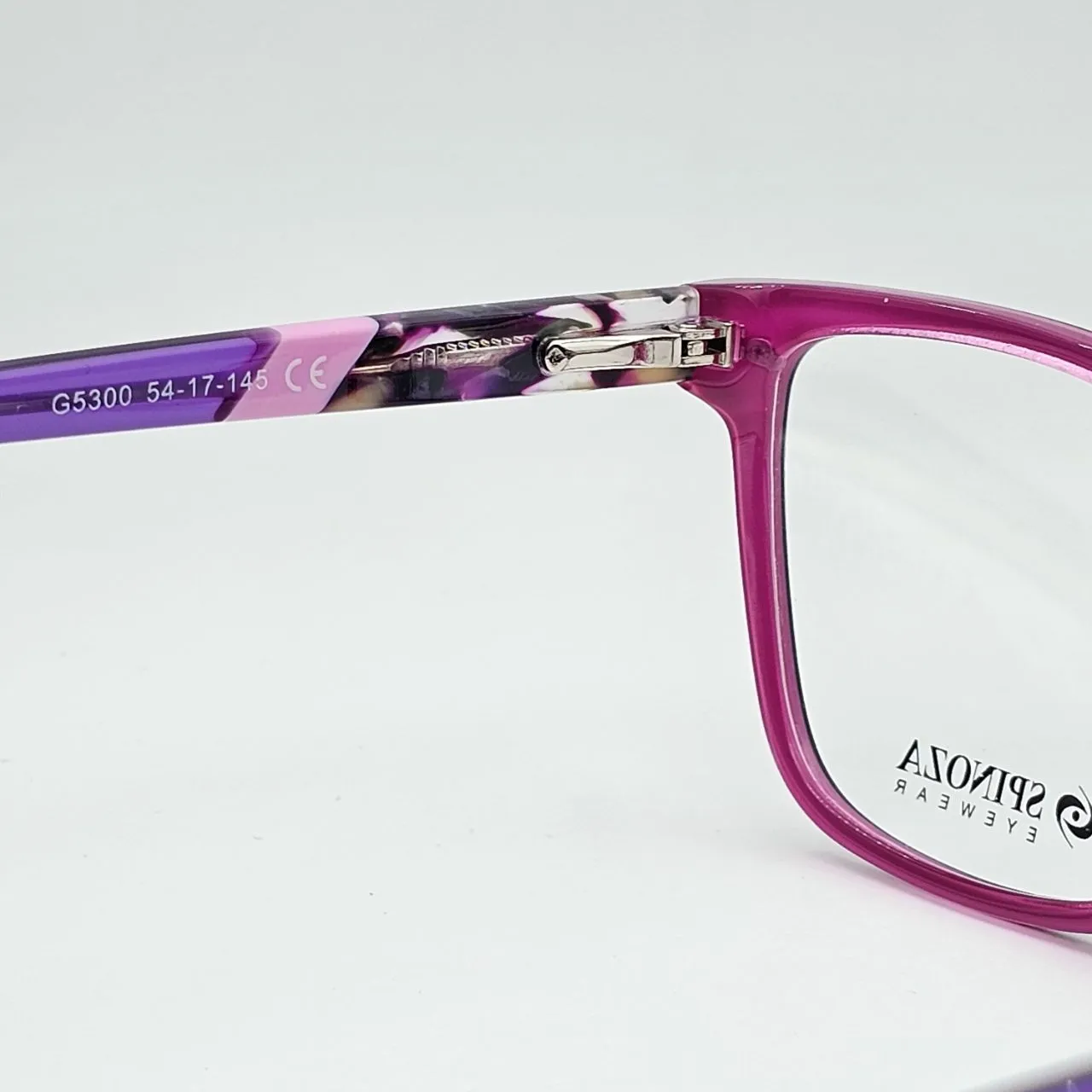 عکس نمای از بالا عینک طبی کاوردار برند Spinoza رنگ pink,purple