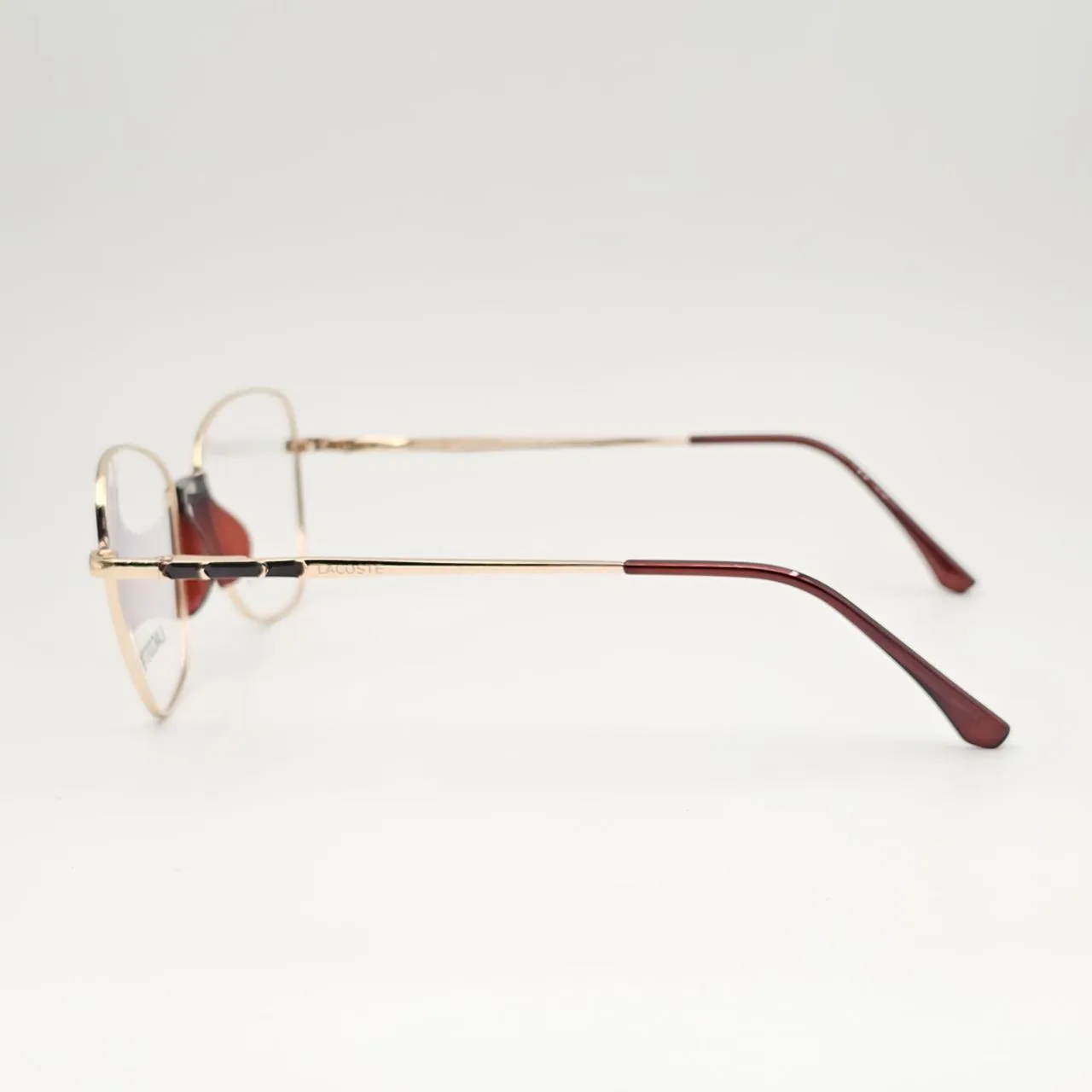 خرید عینک طبی زنانه فلزی گربه ای برند Lacoste کد 201 رنگ gold:طلایی عنابی,brown