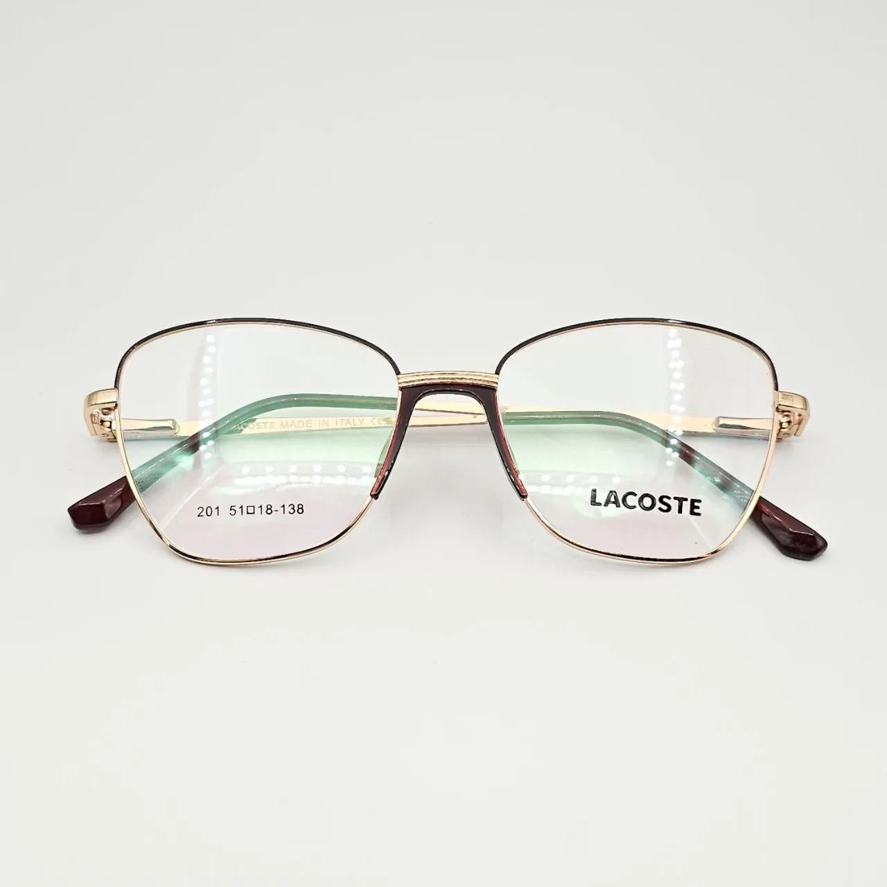 عکس نمای دسته عینک طبی زنانه فلزی گربه ای برند Lacoste کد 201 رنگ gold,brown