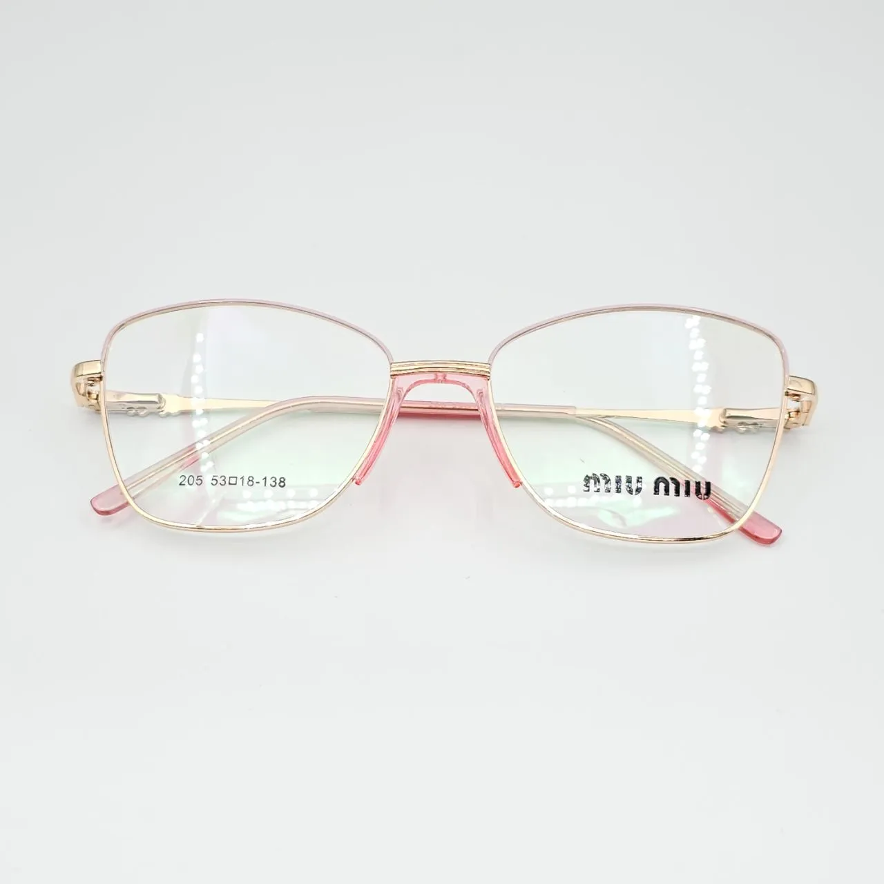 عکس نمای از بالا عینک طبی مردانه-زنانه miu miu کد 205 رنگ gold,pink