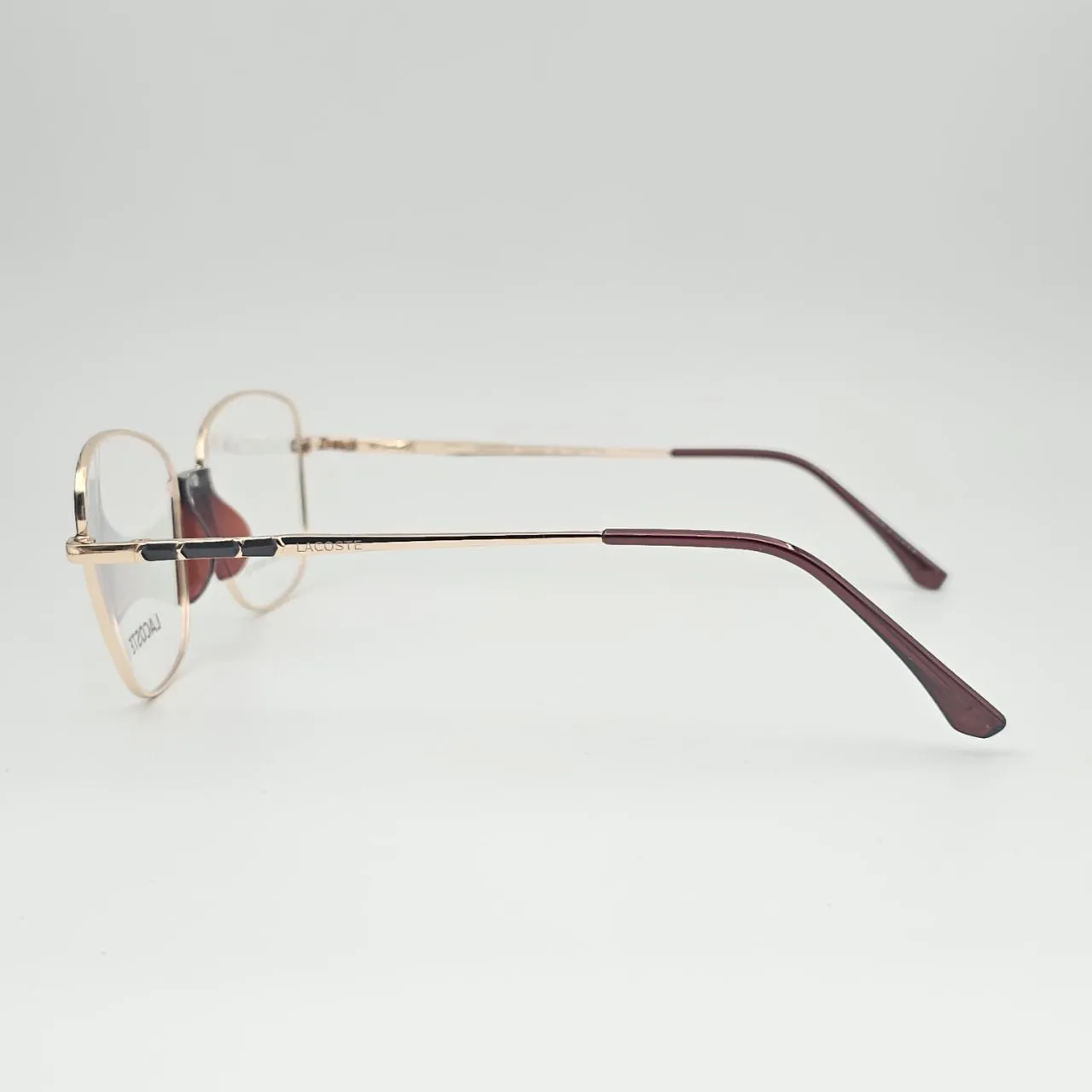 عکس نمای 45 درجه عینک طبی زنانه Lacoste کد 209 رنگ gold,brown