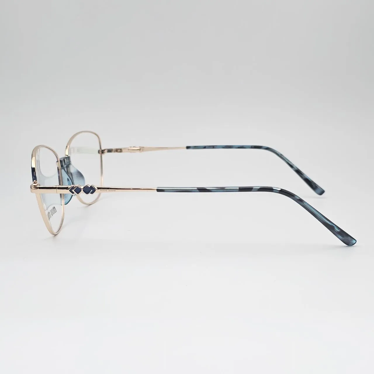 عکس نمای از بالا عینک طبی miu miu کد 211 رنگ gold,blue