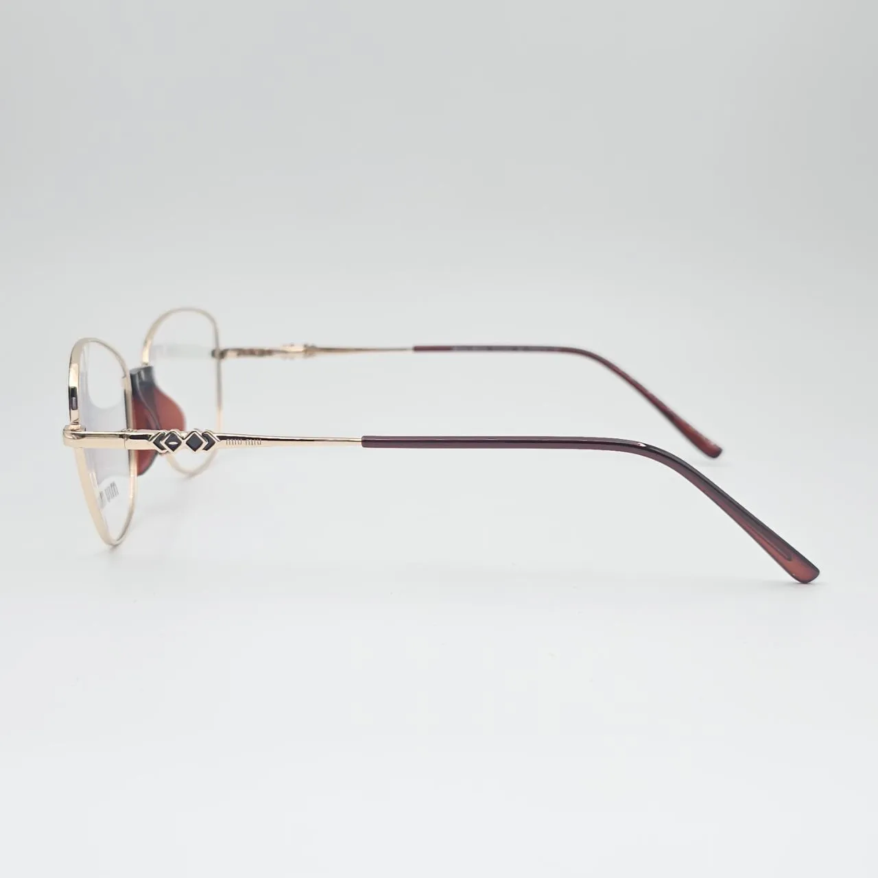 عکس نمای 45 درجه عینک طبی miu miu کد 211 رنگ gold,brown|glossy