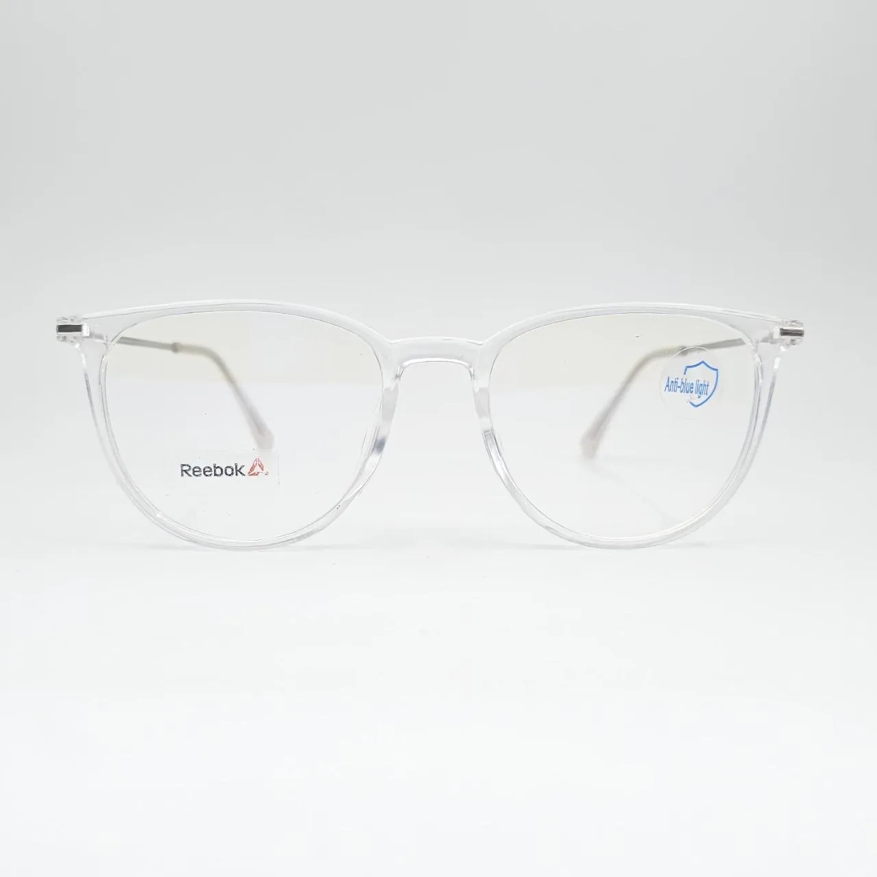 خرید عینک طبی گرد بلوکات و شفاف برند Reebok رنگ transparent