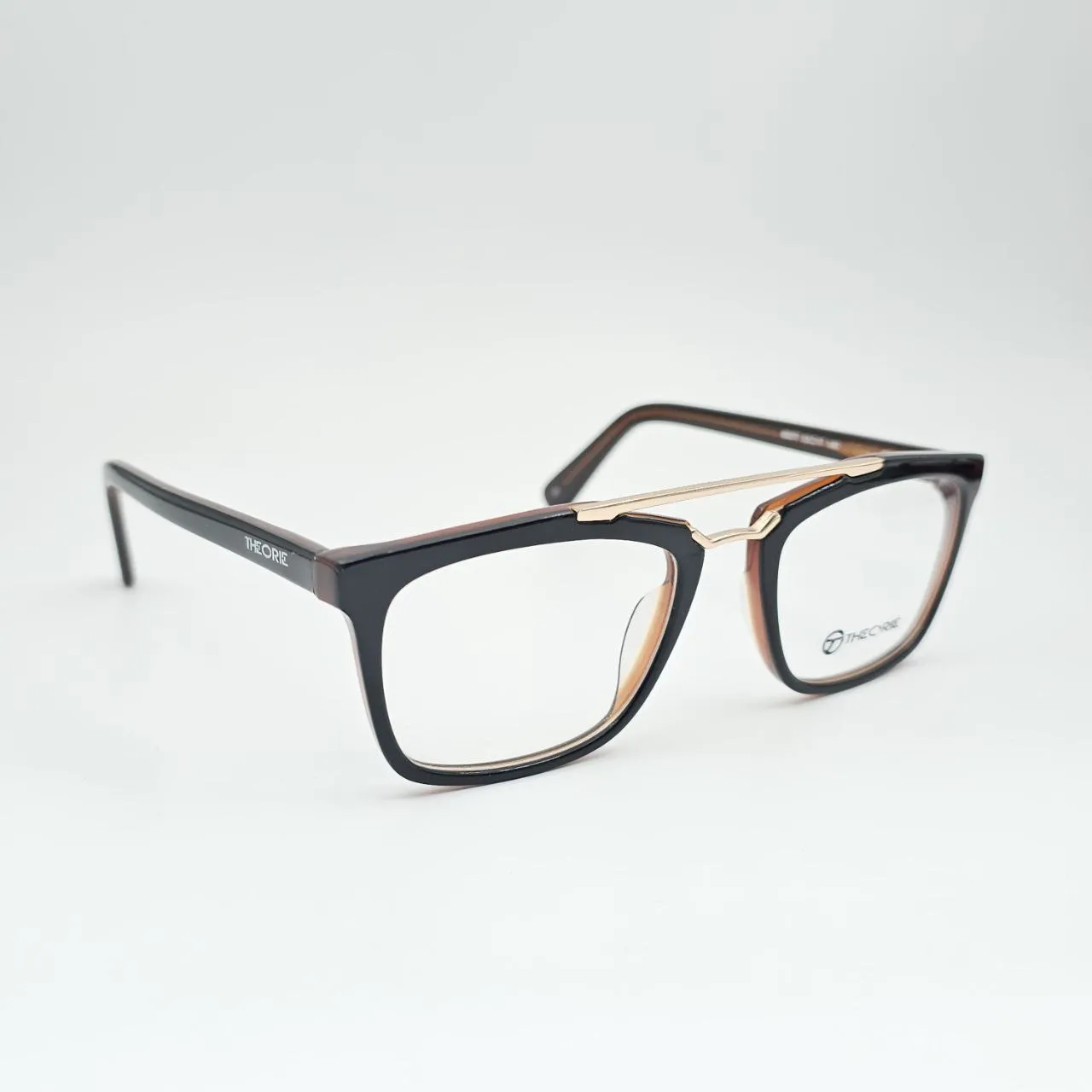 عکس نمای 45 درجه عینک طبی مربعی دوپل THEORIE رنگ black,brown