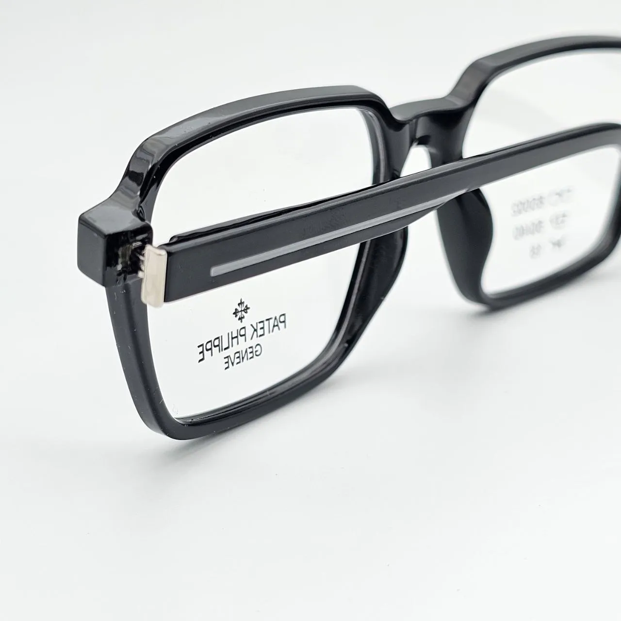 عکس نمای از بالا عینک طبی نشکن برند PATEK PHLIPPE رنگ black,gray