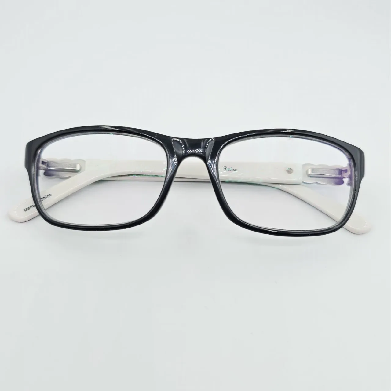 عکس نمای از بالا عینک مستطیلی مشکی و سفید با نگین کاری رنگ black,silver