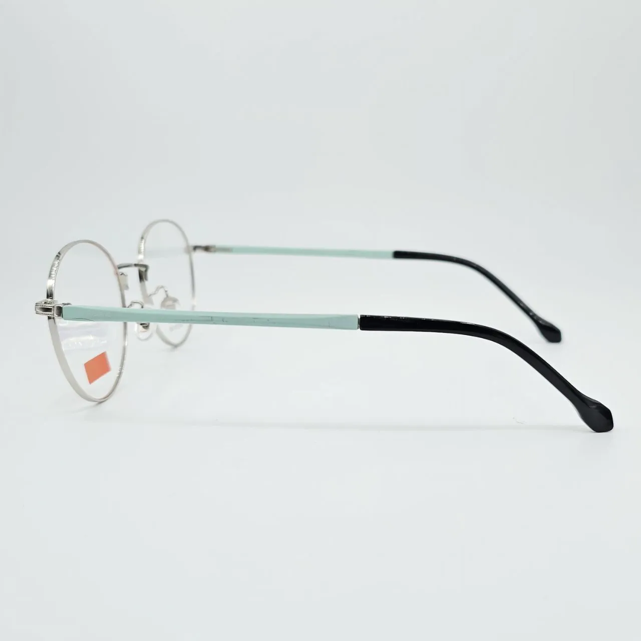 عکس نمای 45 درجه عینک طبی گرد نقره ای مردانه-زنانه رنگ silver,green