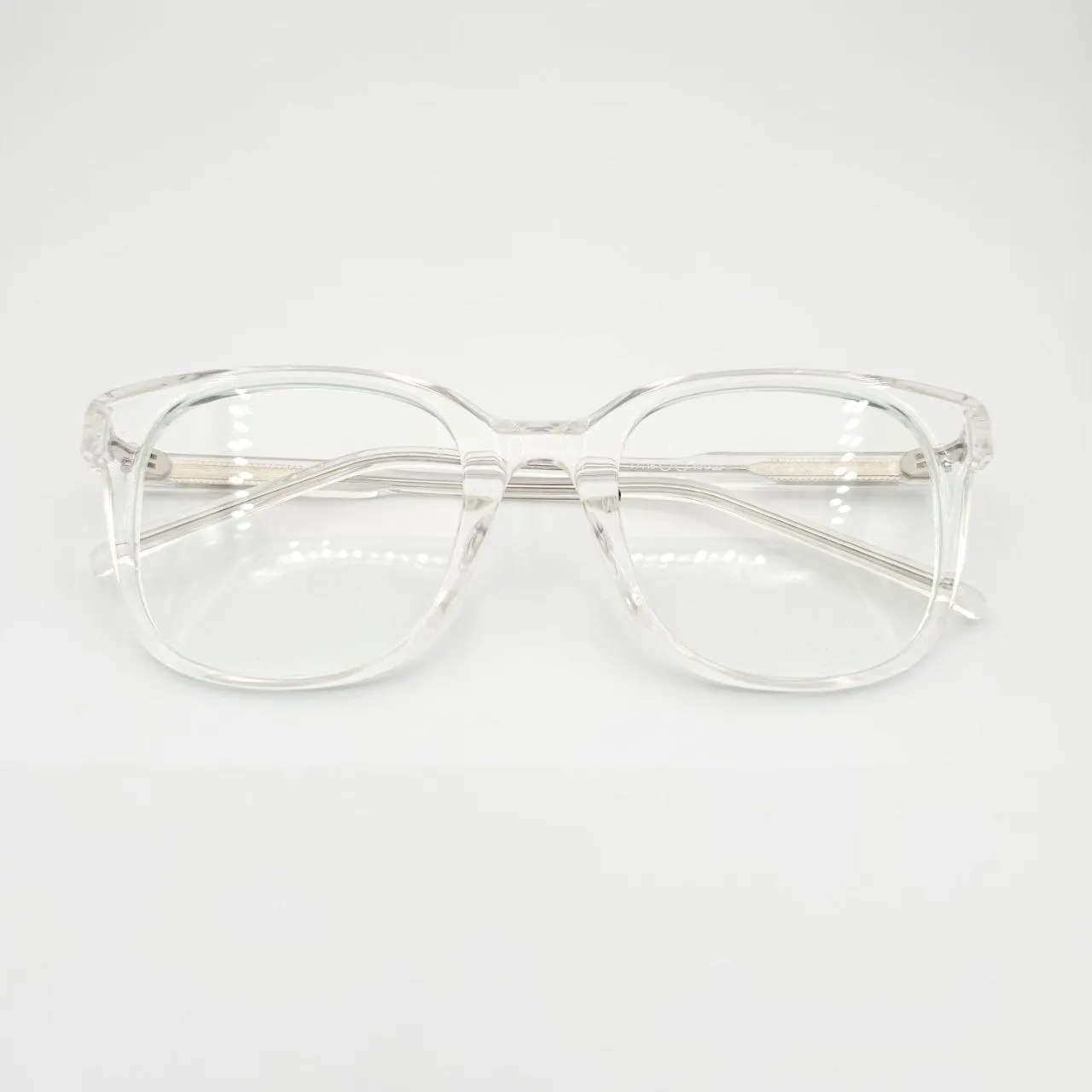 عکس نمای از بالا عینک طبی مربعی شفاف TR90برند MOSCOT رنگ transparent