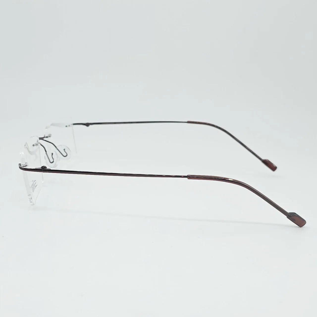 عکس نمای 45 درجه عینک طبی بدون فریم Silhouette رنگ brown