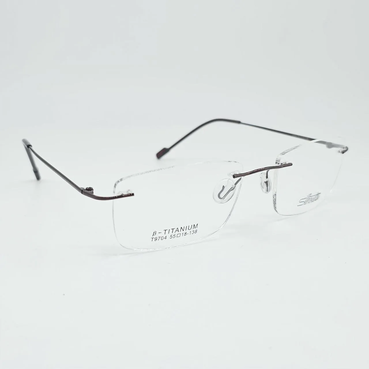 عکس نمای 45 درجه عینک طبی بدون فریم Silhouette رنگ brown