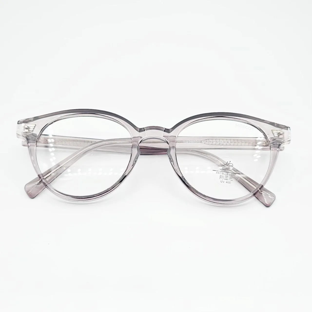 عکس نمای از بالا عینک طبی گرد نشکن برند MOSCOT رنگ beige