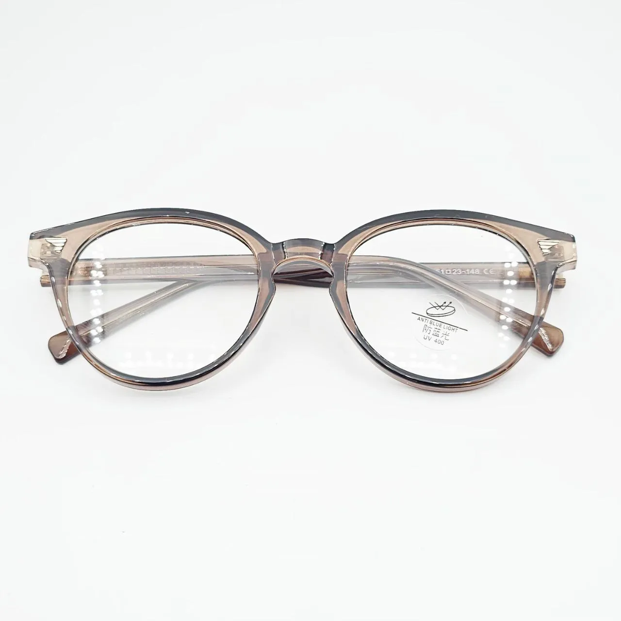 عکس نمای از بالا عینک طبی گرد نشکن برند MOSCOT رنگ brown