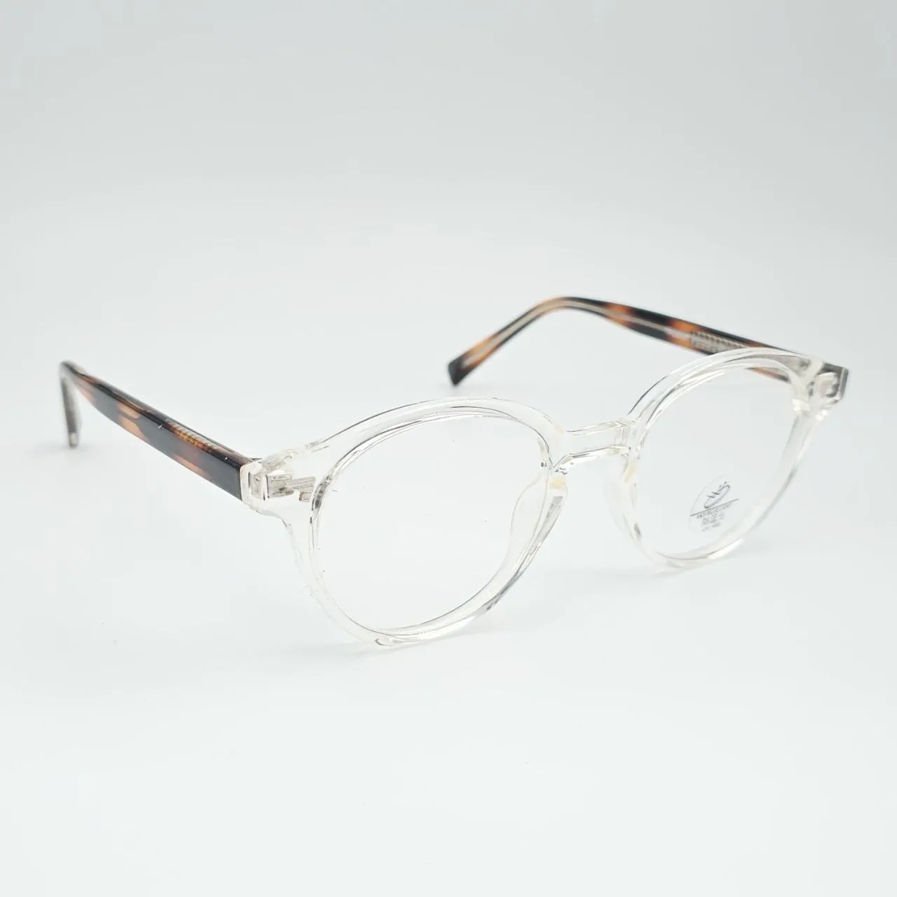 عکس نمای از بالا عینک طبی گرد شفاف TR90 با دسته پلنگی برند MOSCOT رنگ transparent,leopard